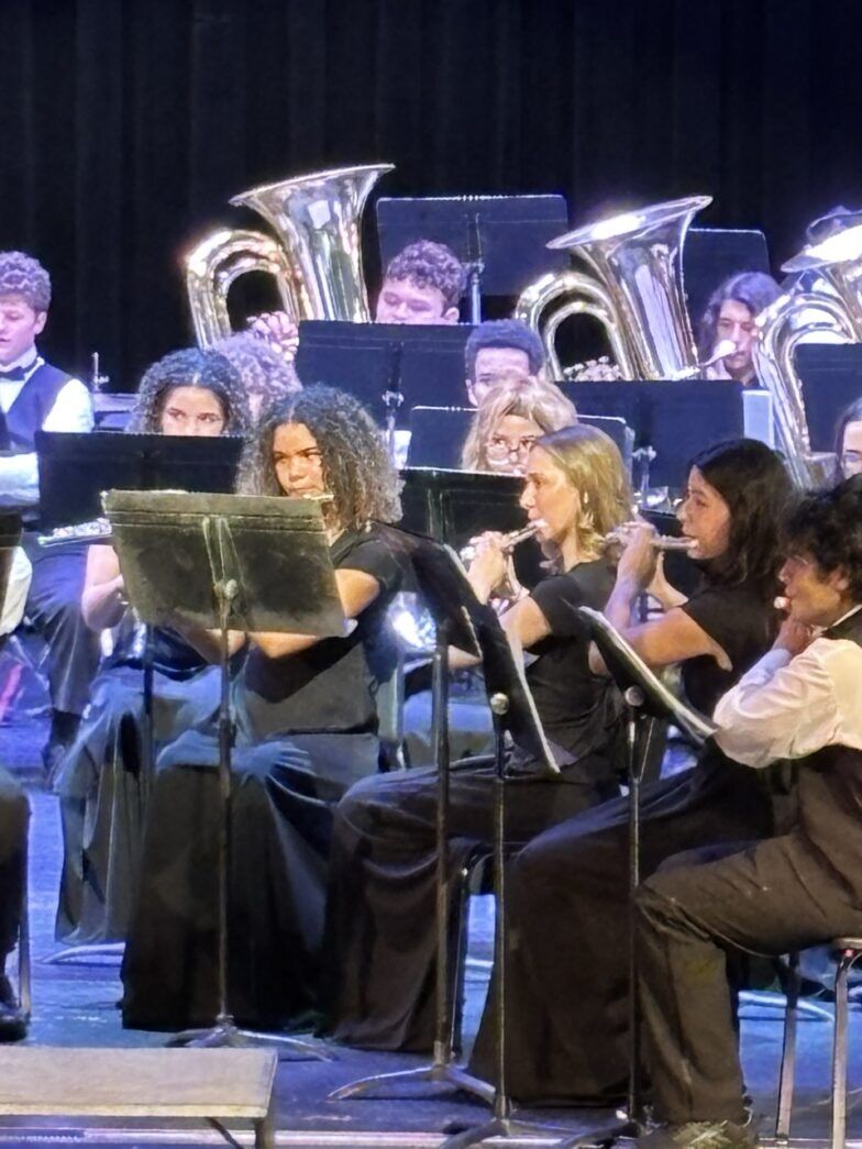 a group of people that are sitting on a stage