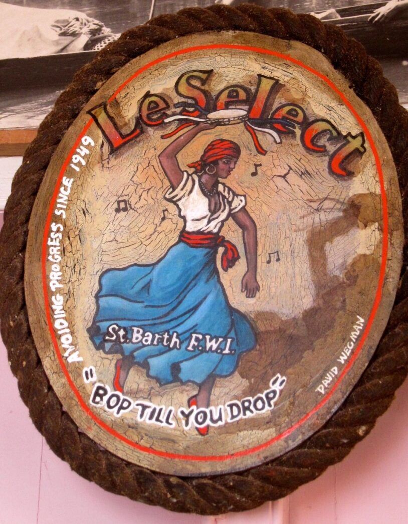 a picture of a woman in a blue dress on a wall