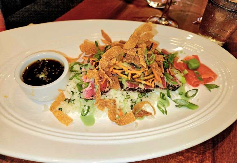 a plate of food on a wooden table
