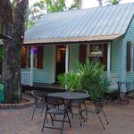 A group of lawn chairs sitting on top of a house - Grunts Bar