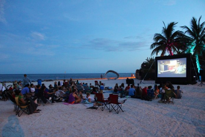0919_OutdoorMovies1 #DayTripping: Key West Outdoor Movies - A group of people riding horses on a beach - Beach