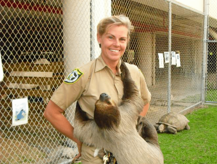 Jeanne Selander – Animal Farm Supervisor - A person petting a dog - The Key West Weekly Newspaper