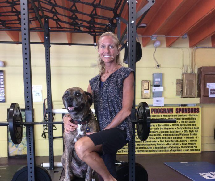 1017cancer #Feature: Woman chooses surgery, positive healing - A person holding a dog posing for the camera - Dog