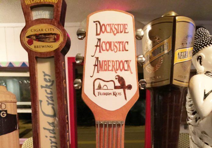 1212DocksideAnniversary1 #Events: Dockside owners celebrate one year - A group of flyers on a table - Alcoholic Beverages