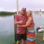 #Events: Dockside owners celebrate one year - A man standing next to a body of water - Boat