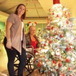 #SeenAroundTown: Festival of Tree culminates in Gala - A man and a woman standing in a room -