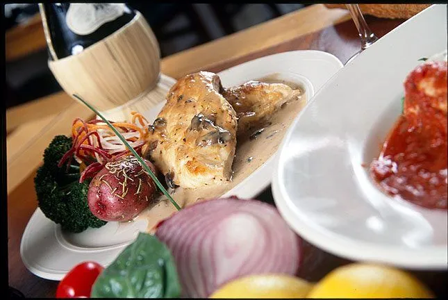 Enjoy Italian cuisine at Abbondanza - A plate of food on a table - Full breakfast