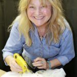 ‘Talk Derby to Me’ - A woman sitting on a table - Blond
