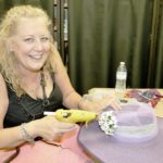 ‘Talk Derby to Me’ - A woman sitting on a table - Torte