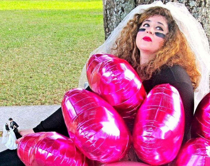 wwpromo One Woman Show: ‘The Wedding Warrior’ in Islamorada - A girl is sitting in the grass - Girl