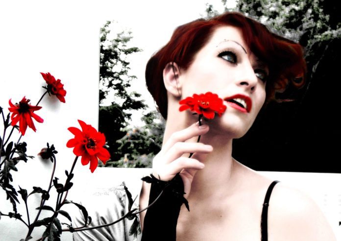 1209amanda-palmer1 Revisionist Art: Concert & Book Signing at TSKW - Amanda Palmer wearing a red flower in her hair - The Art of Asking