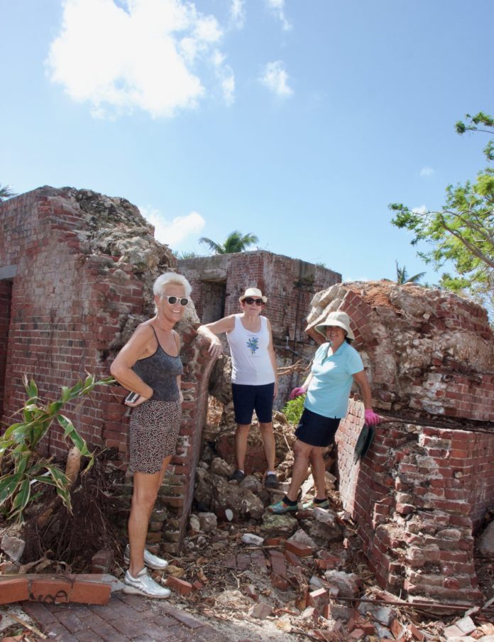 West Martello Looks Ahead after Damage - A group of people standing on a rock - West Martello Tower