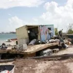 Wisteria Island: It’s complicated - A boat sitting on top of a sandy beach - Mallory Square