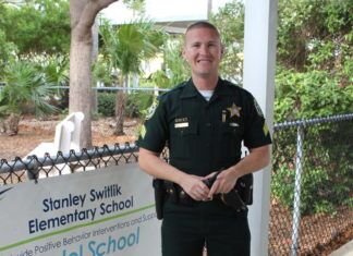 STANLEY SWITLIK GETS SRO STANLEY SWITLIK GETS SRO - A man standing in front of a fence - Stanley Switlik Elementary