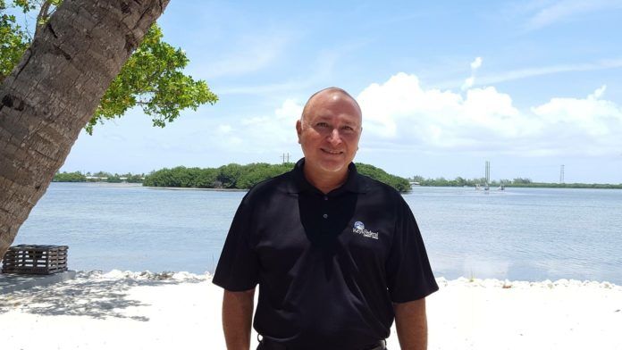 0927Beeman20Q The Bee Man – Jason Beeman — banker, Conch — reflects on the life and times - A man standing next to a body of water - Sea