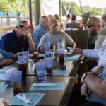 25 Disabled Veterans Are Honored - A group of people sitting at a table - Islamorada