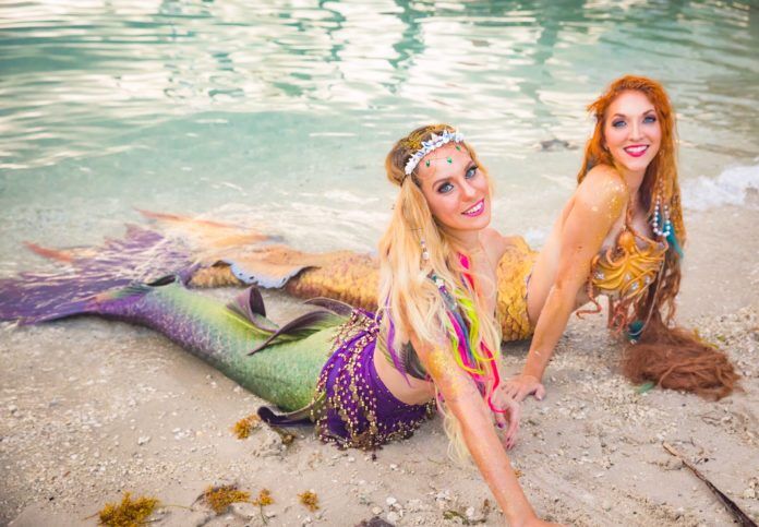 Politics and Mermaids. Yes, We Said it. Now Read It! - A woman lying in a body of water - Fantasy Fest
