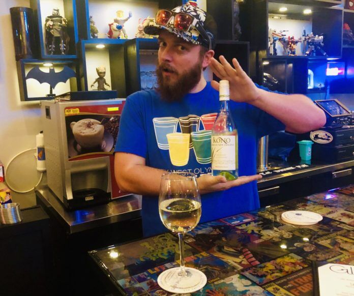 glitchcraft “Glitch” reimagines the bar game - A person sitting at a table with wine glasses - Glitchcraft