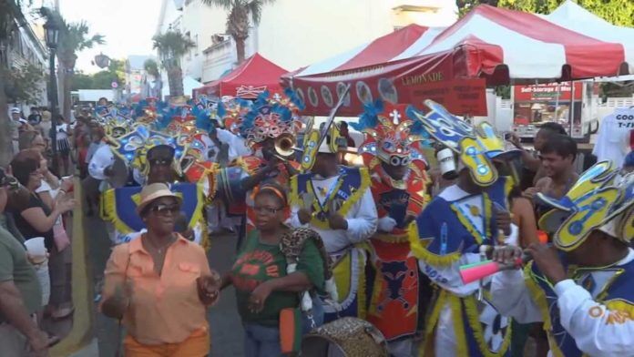 junkanoo The Good, the Bad, the Funky: The Goombay Story - A group of people standing in front of a crowd posing for the camera - Junkanoo