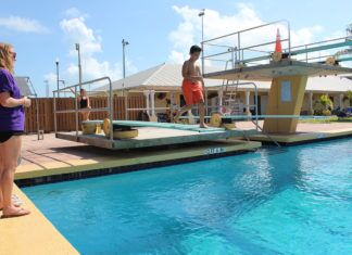 Kater spring boarding into teaching Kater spring boarding into teaching - A woman standing in a pool of water - Leisure
