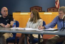 Mucarsel-Powell takes role in disaster recovery - A group of people sitting at a table - Debbie Mucarsel-Powell