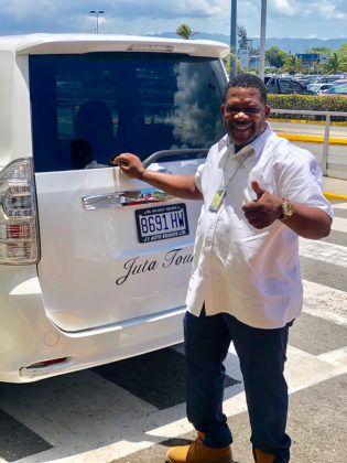 Jamaica in 24 Hours: An island adventure in a day - A man standing in front of a truck - Car