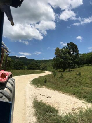 Jamaica in 24 Hours: An island adventure in a day - A person riding a bike down a dirt road - Hotel