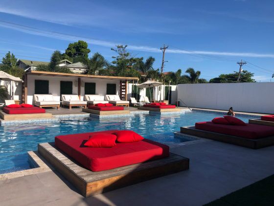 Jamaica in 24 Hours: An island adventure in a day - A red and white boat sitting next to a body of water - Swimming Pools