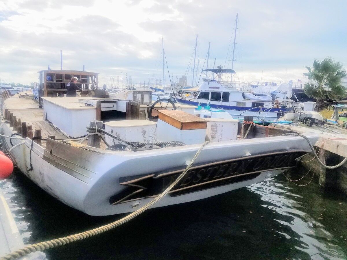 Saving a schooner – Historic flagship limps home to Key West - A boat is docked next to a body of water - Yacht