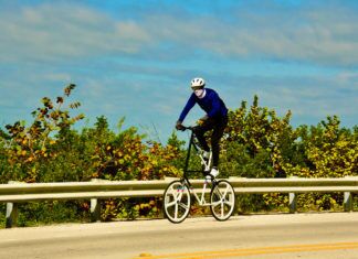 TALL BIKER PEDALS TO KEY WEST WHILE DRAWING ATTENTION ON U.S. 1