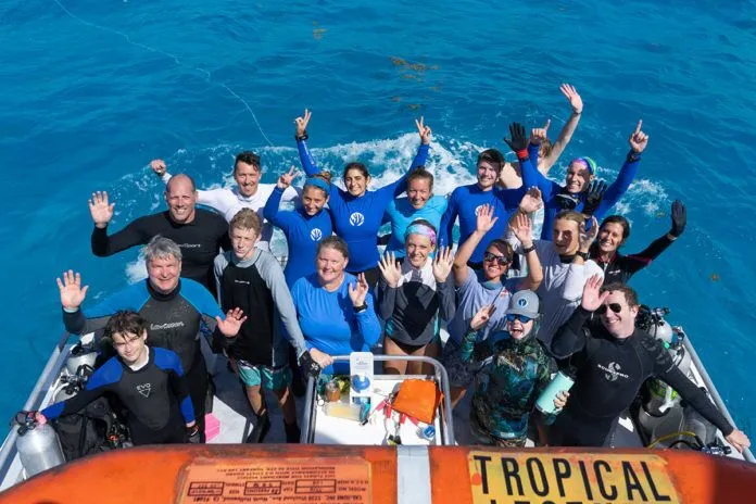a group of people riding on top of a boat