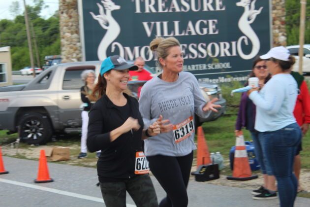 a couple of women that are running in a race