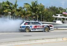 TRAVIS PASTRANA PERFORMS DRIFT STUNTS DURING VIDEO SHOOT IN THE KEYS a car with a lot of smoke coming out of it