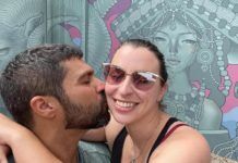 DATING IN THE KEYS: POPULAR SPOTS LOCALS MEET THEIR SPECIAL SOMEONE a man and a woman kissing in front of a mural