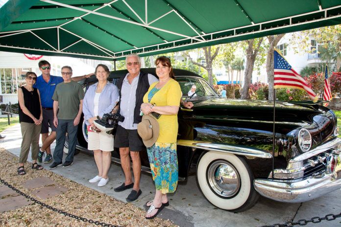 4-Picnic_C-Tedesco_5Q0A8871 a group of people standing in front of a classic car