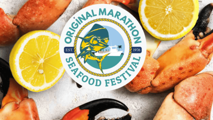 Website Image a plate of food with lemons, crab legs, and mussels