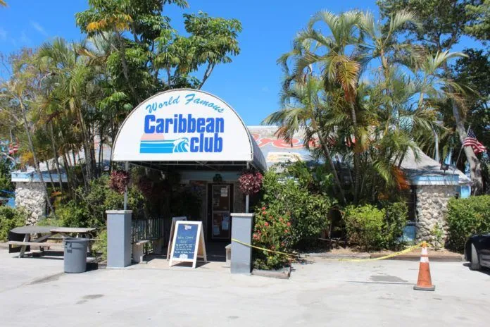 Caribbean Club a car is parked in front of a restaurant