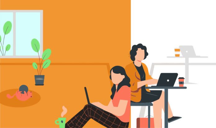 a couple of people sitting at a table with laptops