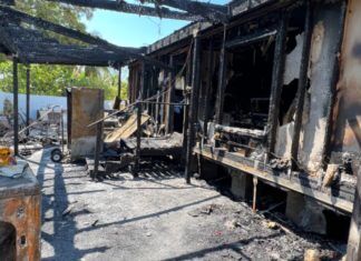 a burned out building with a fire hose attached to it
