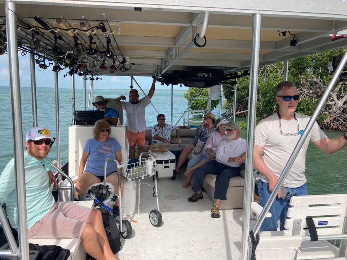 a group of people on a boat on the water