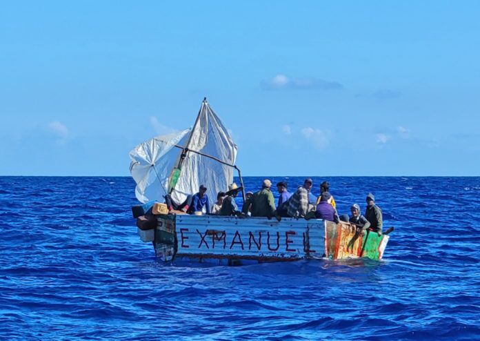 Cuba chug UK 1 a group of people on a small boat in the ocean