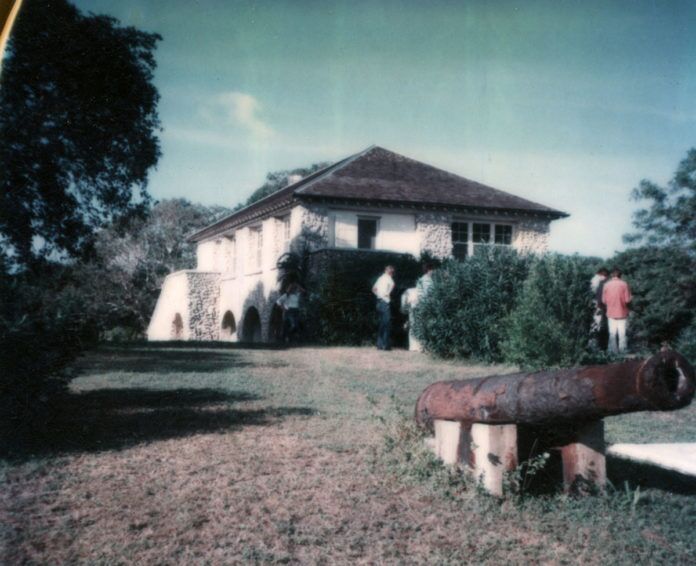 December-1-1977-Bill-Westray-Collection two men standing in front of a white house