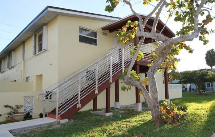 a house with a tree in front of it
