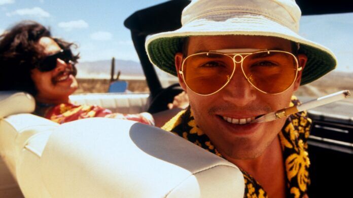 fear_and_loathing_in_las_vegas_-_h_-_1998 a man in a hat and sunglasses sitting in a car