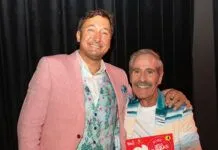 a couple of men standing next to each other