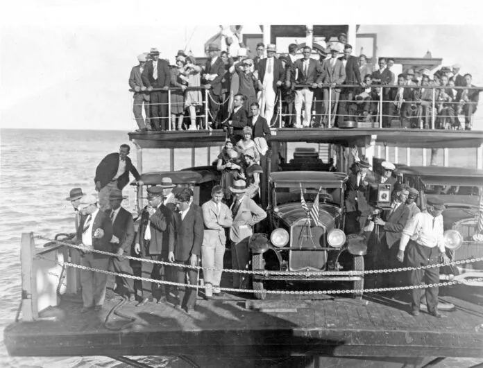 first ferry 1928 23 cars dewolfe and wood collecion monroe county library collection bw Large a large group of people standing on a boat