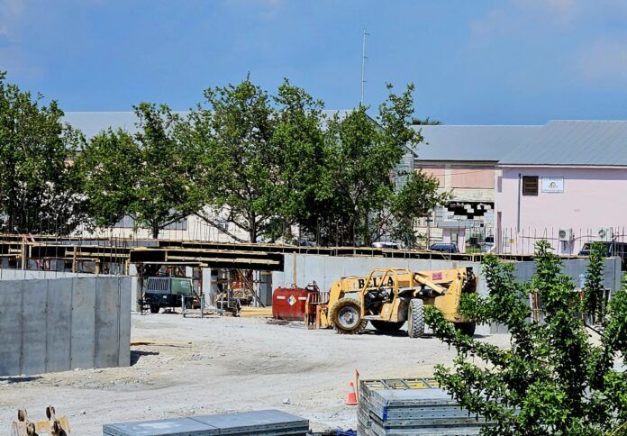 sheriff housing a construction site with construction equipment and trees