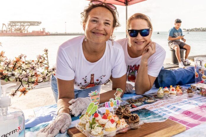 Taste of Key West 2024 NWM-1488 Large a couple of women sitting at a picnic table