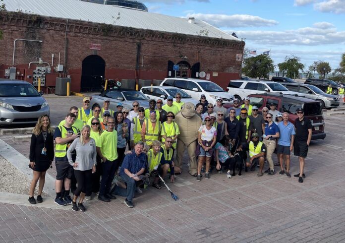 a group of people standing in front of a parking lot