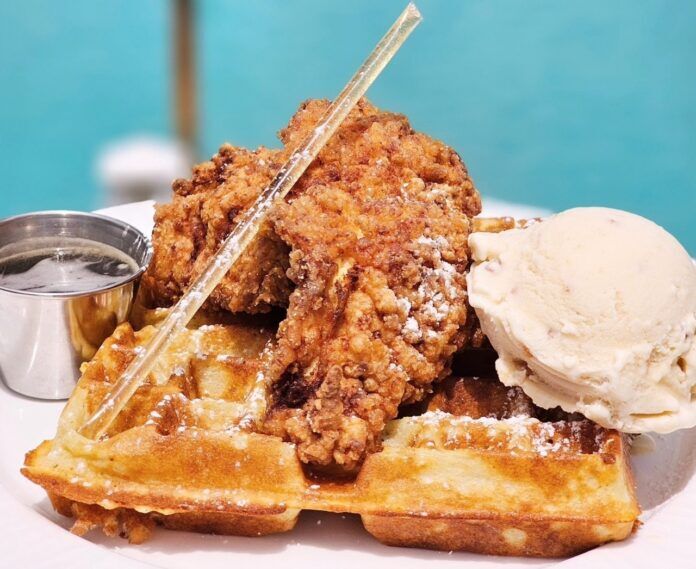 a waffle with a scoop of ice cream on top of it